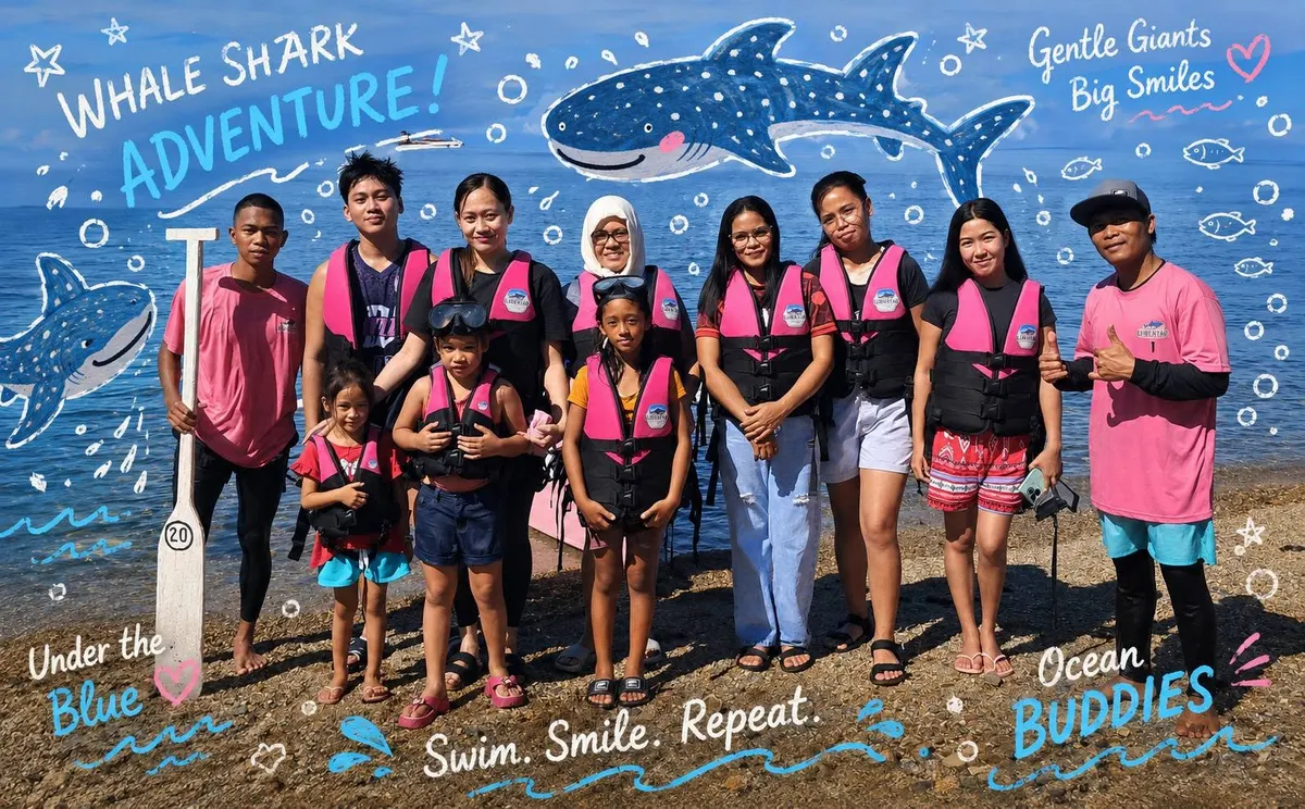 Group photo with whale shark adventure lettering
