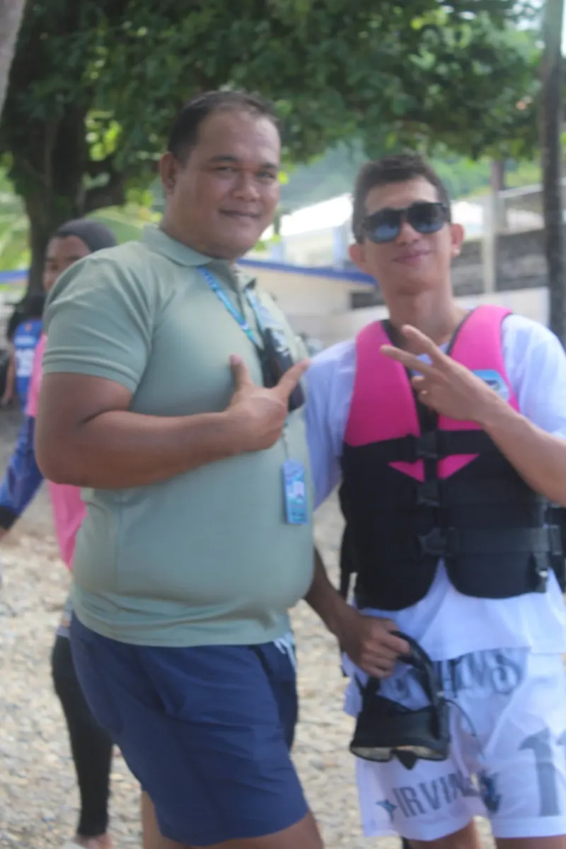 Two guests posing in life vests at the tour site